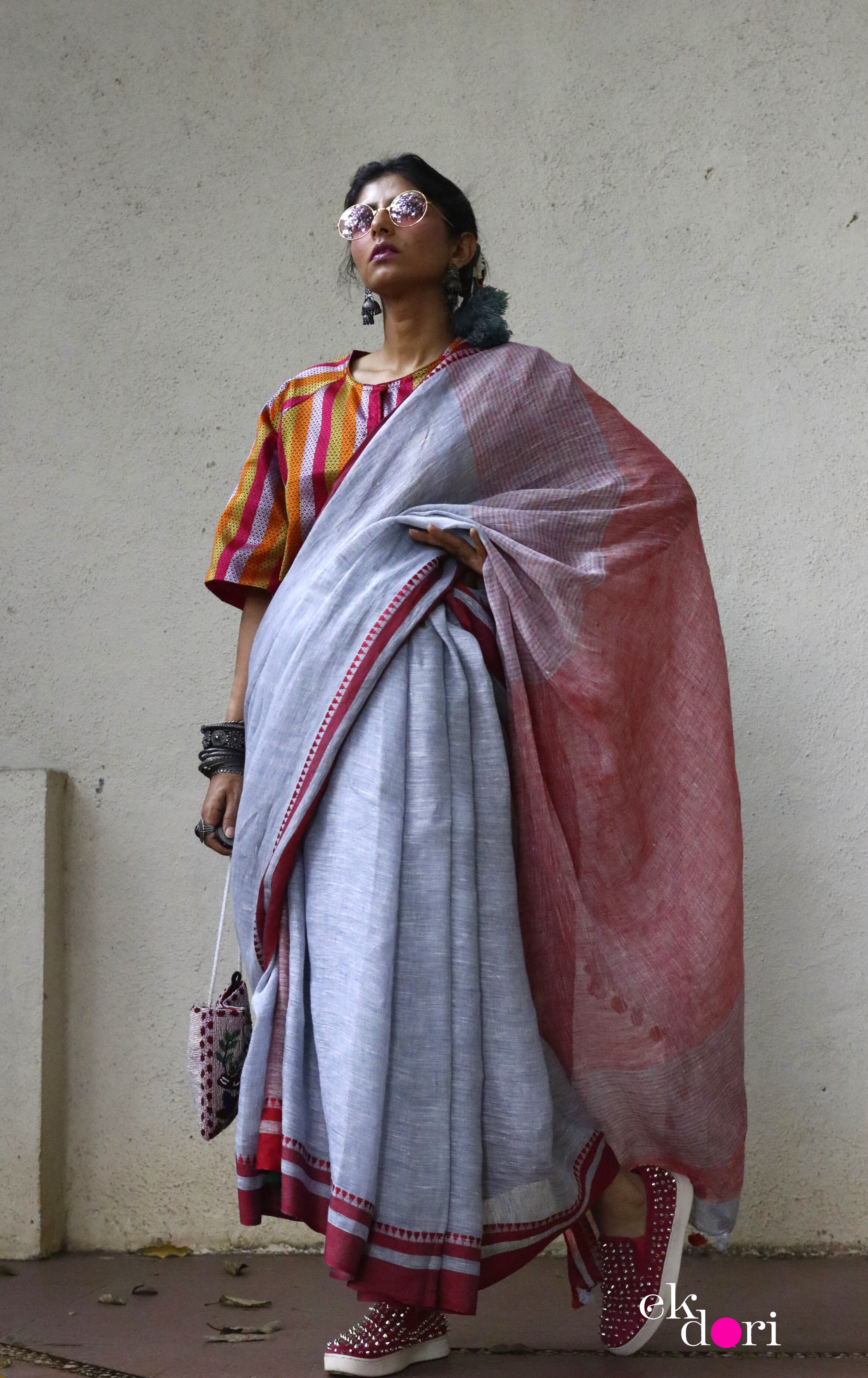 Tvis and Bliss. Black and Orange Pure Linen Cotton Saree with Ball Butta  and Ganga Jamuna Border